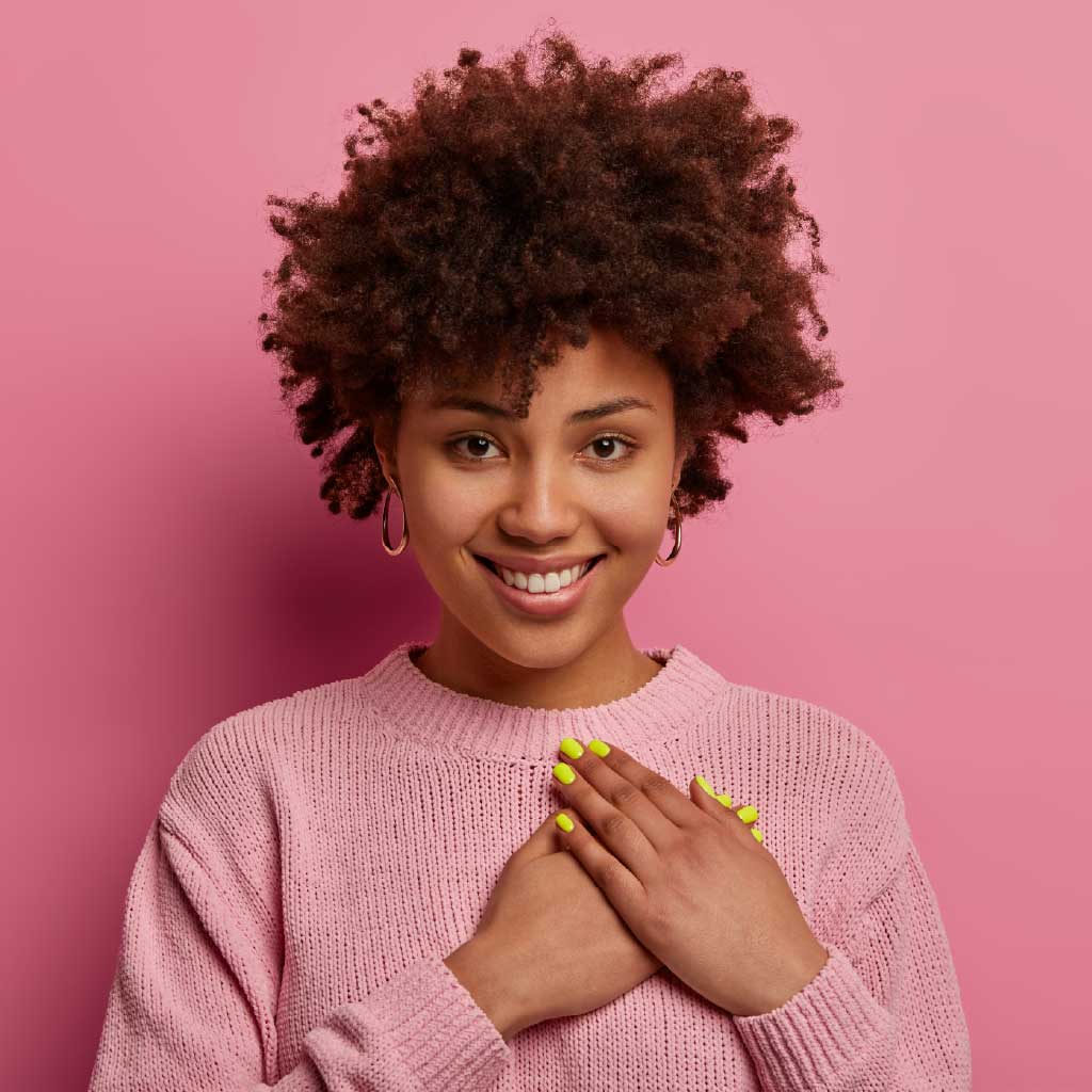 Happy professional woman in pink